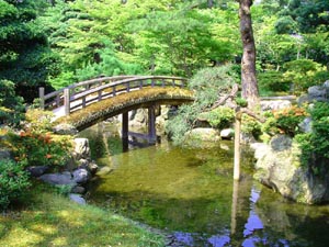 Garden bridge in one of the gardens of the Imperial Palace in Kyoto.  The Imperial Palace was the home of the emperor which Kyoto was the capital and to this day the palace itself is not open to the public.